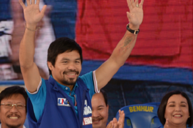  Senatorial candidate of the opposition party and boxing icon Manny Pacquiao greets supporters during his party's proclamation rally in Manila on February 9, 2016.