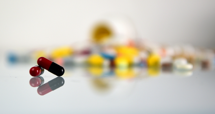  A picture taken on March 14, 2016 shows tablets and capsules in Paris displayed on a desktop for an illustration in Paris.