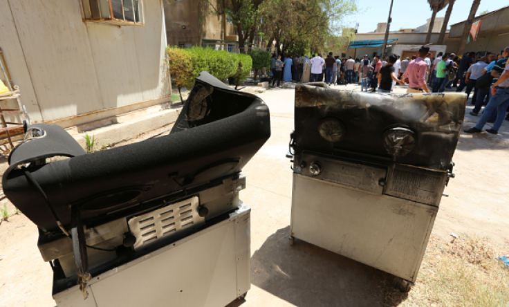 Burnt incubators stand outside Yarmuk hospital in west Baghdad on August 10, 2016 after an overnight fire tore through the maternity ward, killing at least 11 premature babies, medical and security sources said.