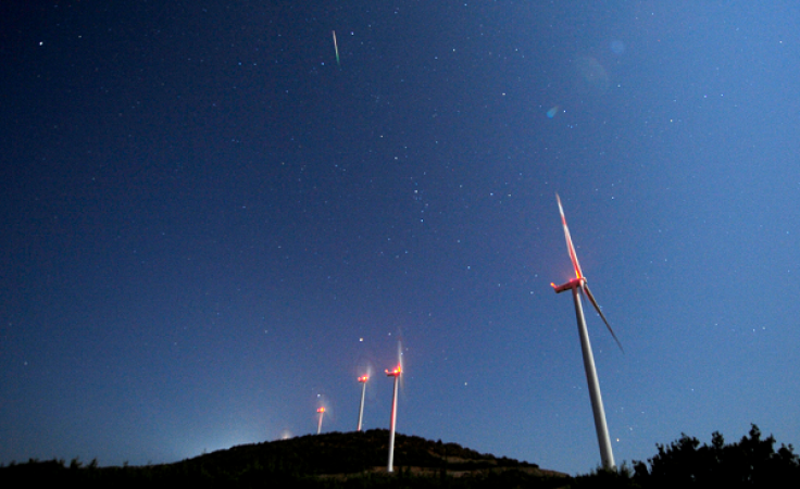 DATE IMPORTED:August 13, 2014A meteor streaks over the sky during the Perseid meteor shower at a windmill farm near Bogdanci, south of Skopje in the early morning August 13, 2014. 