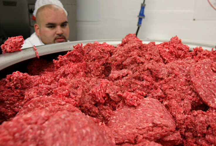 SAN FRANCISCO - JUNE 24: Carlos Vasquez monitors ground beef as it passes through a machine that makes hamburger patties at a meat packing and distribution facility June 24, 2008 in San Francisco, California. 