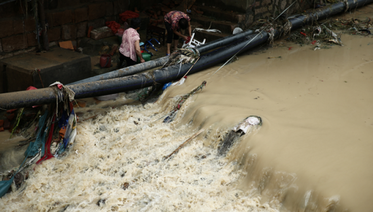 FUZHOU, CHINA - JULY 10: (CHINA OUT) Residents clean the furniture by a river in Bandong Town after Typhoon Nepartak on July 10, 2016 in Minqing County, Fuzhou City, Fujian Province of China