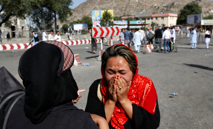 An Afghan woman weeps at the site of a suicide attack in Kabul, Afghanistan July 23, 2016. 