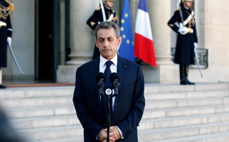 Former French President Nicolas Sarkozy talks to the medias after a meeting with French President Francois Hollande at the Presidential Elysee Palace on November 15, 2015 in Paris, France