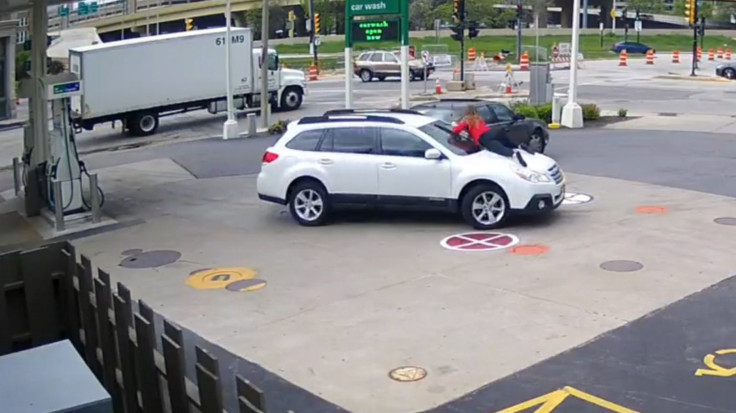 Woman Foils Would-be Carjacker By Leaping On Car Hood