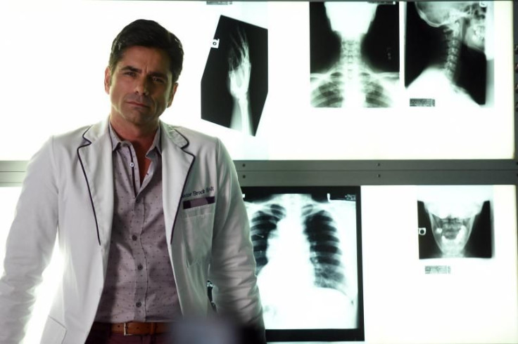 John Stamos as Dr. Brock Holt