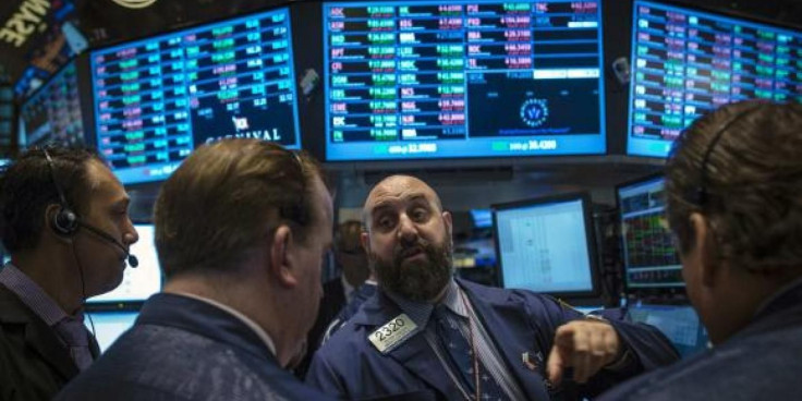 Traders work on the floor of the New York Stock Exchange, Oct 3, 2013. 