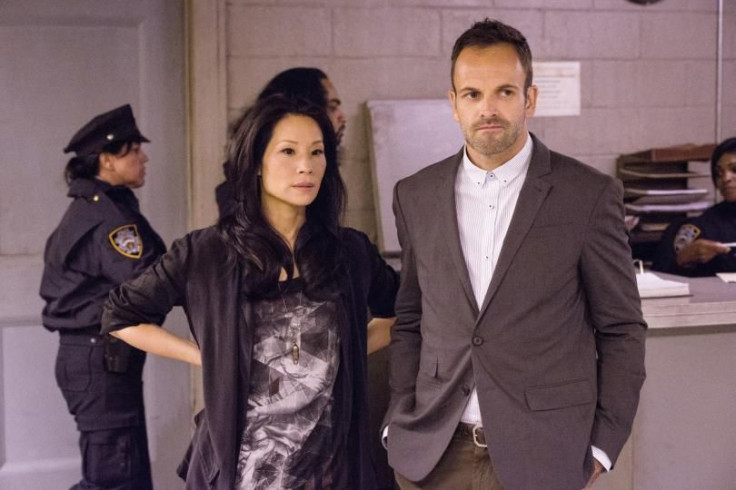 Lucy Liu as Joan Watson, Jonny Lee Miller as Sherlock Holmes