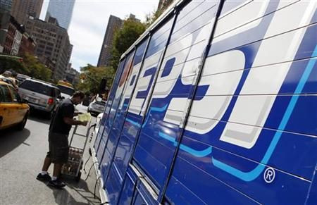 Workers unload a truck of Pepsi products in New York