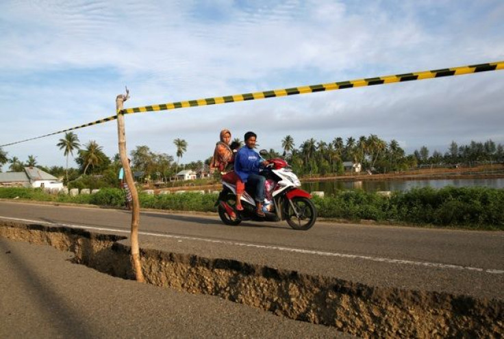 Authorities in Chile issue a tsunami warning following a 7.7 magnitude earthquake on Christmas Day.