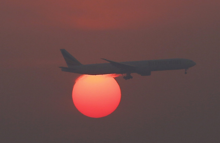 Plane flying across sky