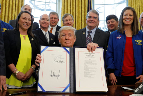 Trump holds up NASA transition authorization act.