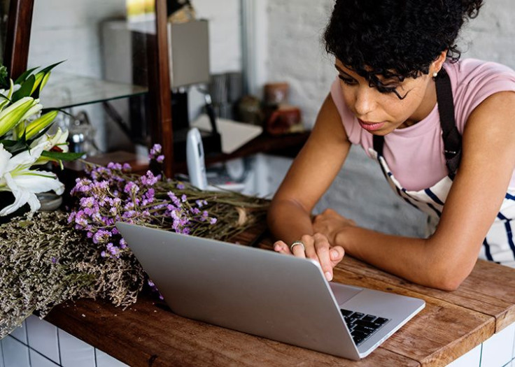 Small business owner works on her laptop