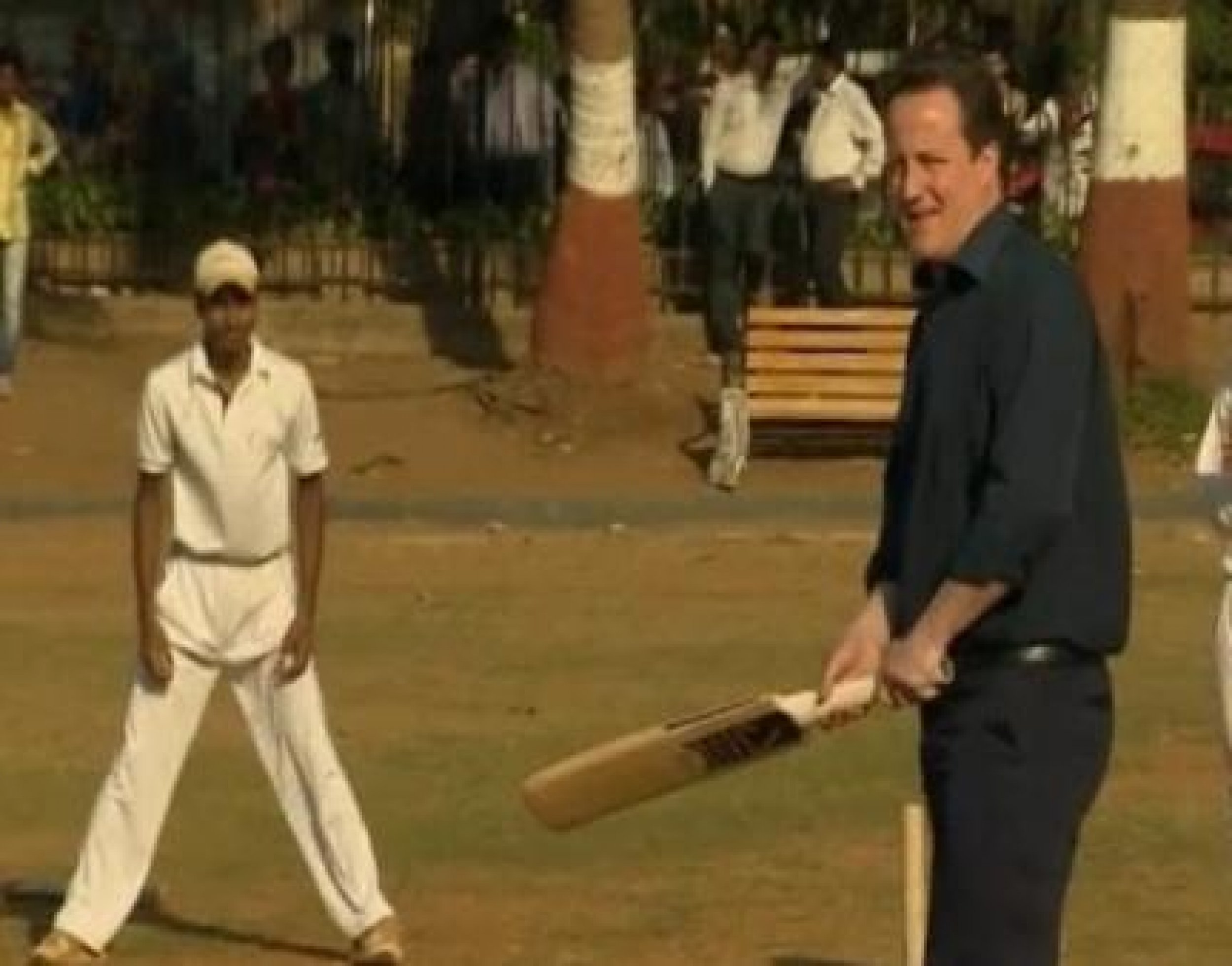 Cameron Breaks From Trade Talks To Play Cricket With Indian Youth