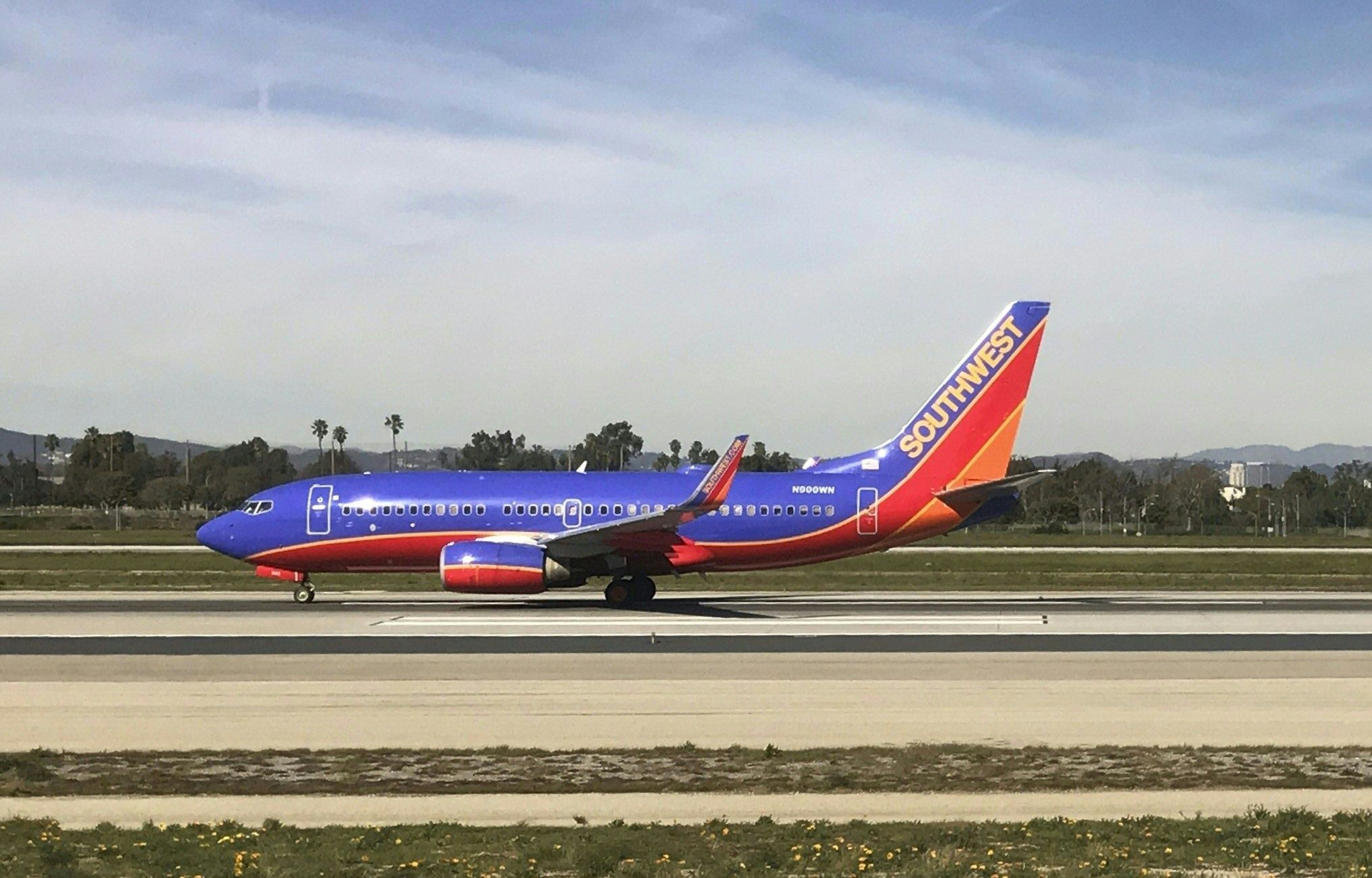 Southwest Plane Diverted After Woman Tries Opening Emergency Exit On