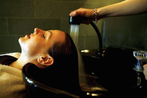 Woman applying conditioner.