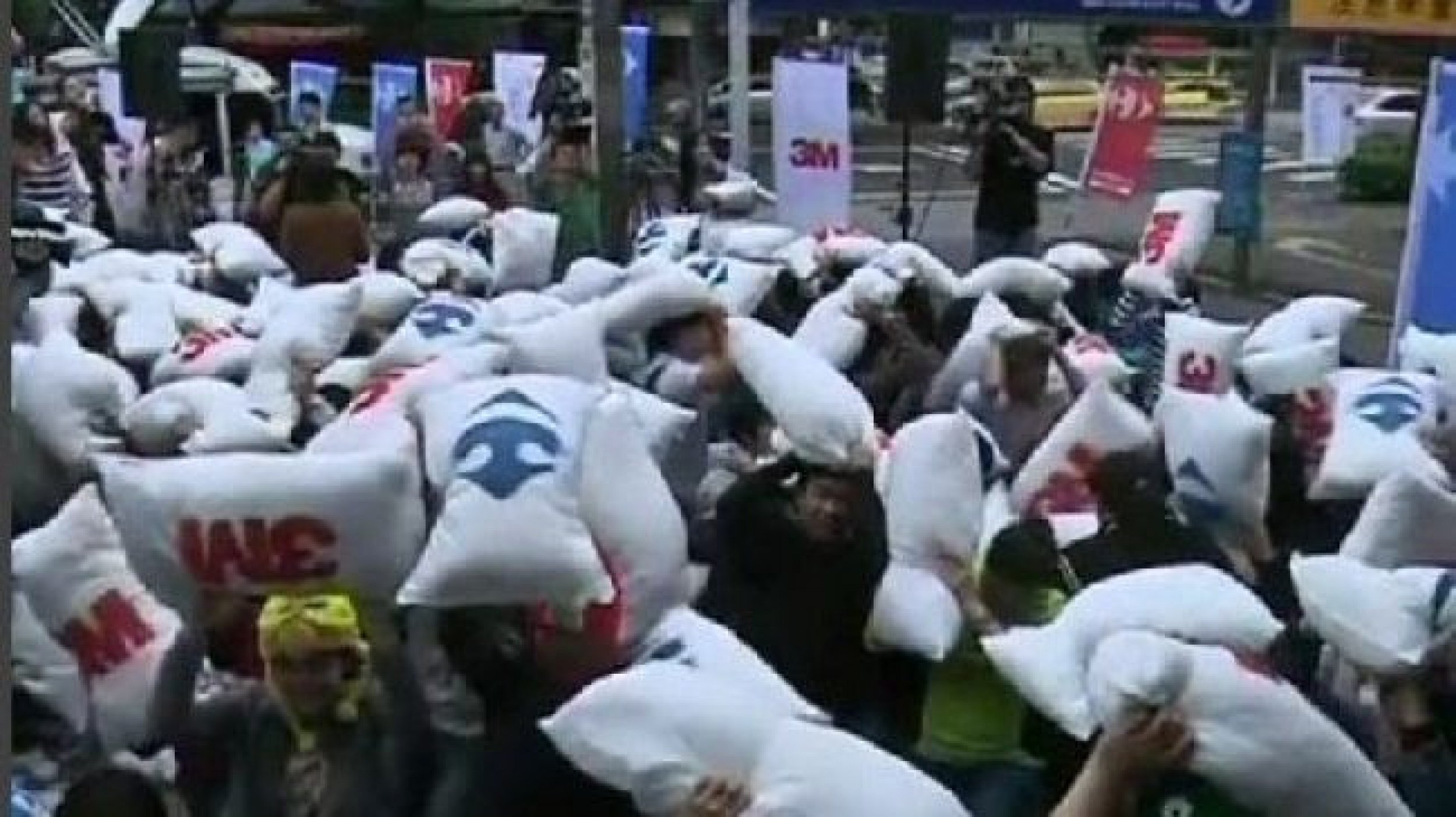 Feathers Fly in Street Marking International Pillow Fight Day