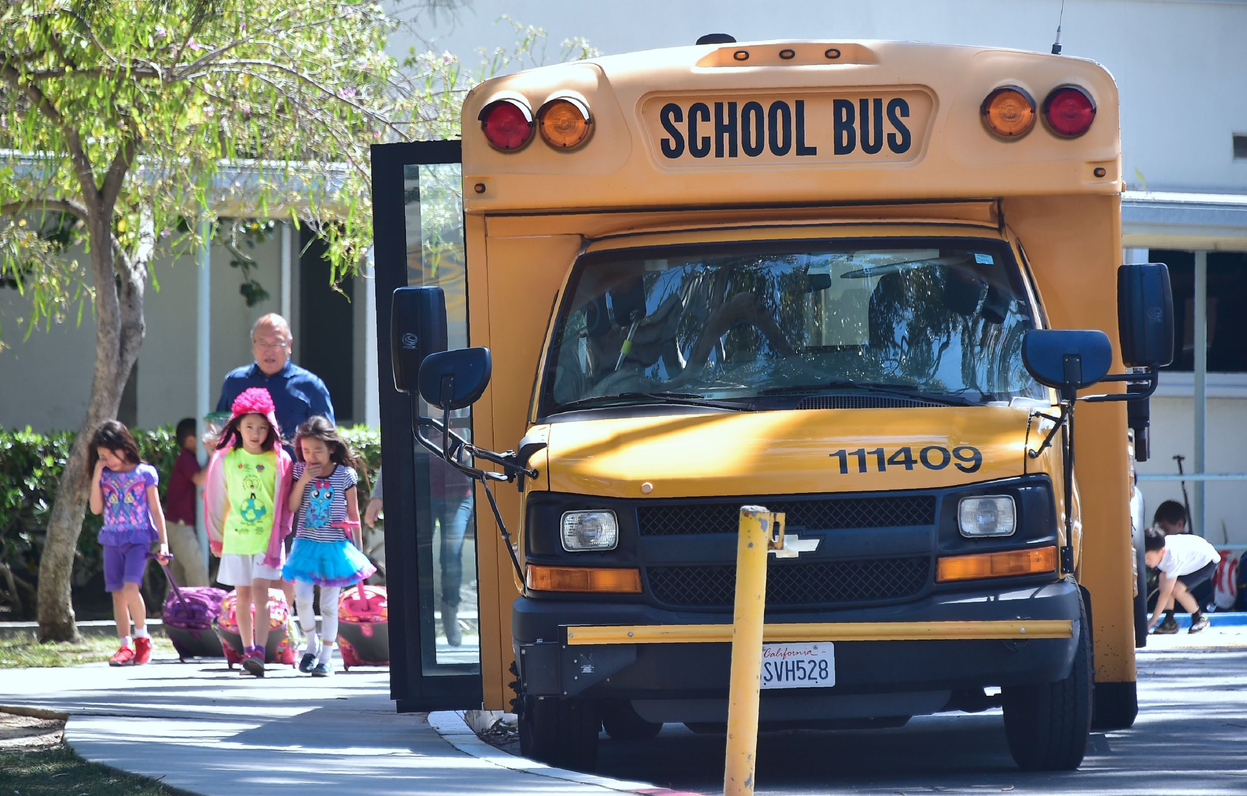 WATCH: Angry 68-year-Old Man Clings To Moving Maryland School Bus | IBTimes