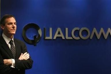 Qualcomm Chief Executive Paul Jacobs poses during his meeting with reporters in Hong Kong