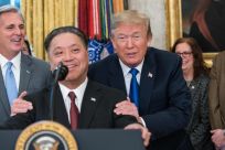 US President Donald Trump jokes with Broadcom CEO Hock Tan
