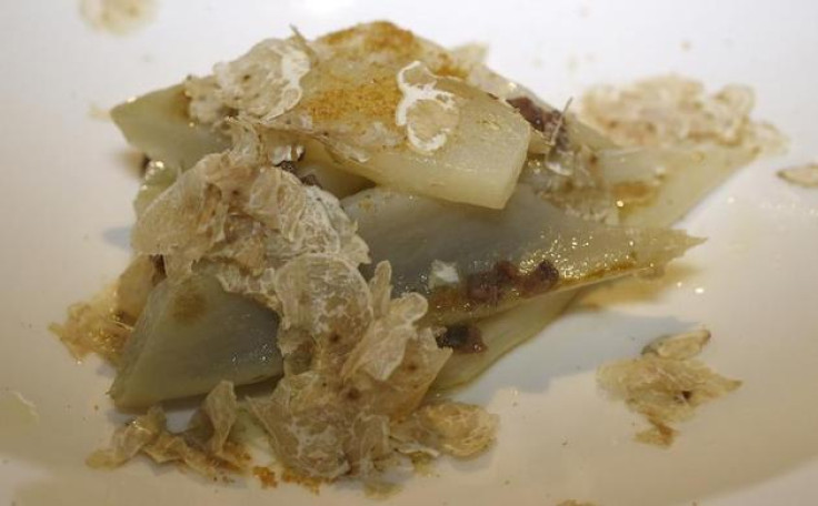 A dish of cardoon with white truffle and pear is seen at the Guido restaurant in Serralunga d'Alba, in north-western Italy, November 11, 2013. REUTERS-Stefano Rellandini