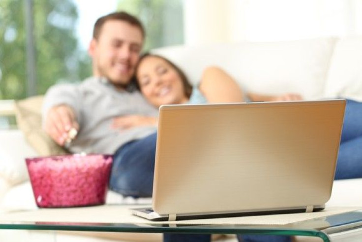 gettyimages-couple-couch-laptop-watch-tv_large