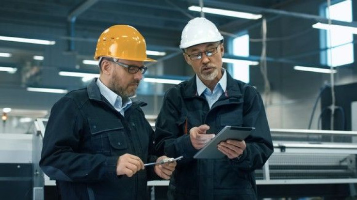 men-in-hard-hats-looking-at-tablet_large