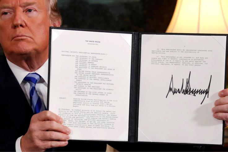 U.S. President Donald Trump holds up a proclamation