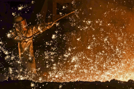 A German steel-worker at a furnace