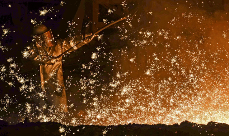 A German steel-worker at a furnace