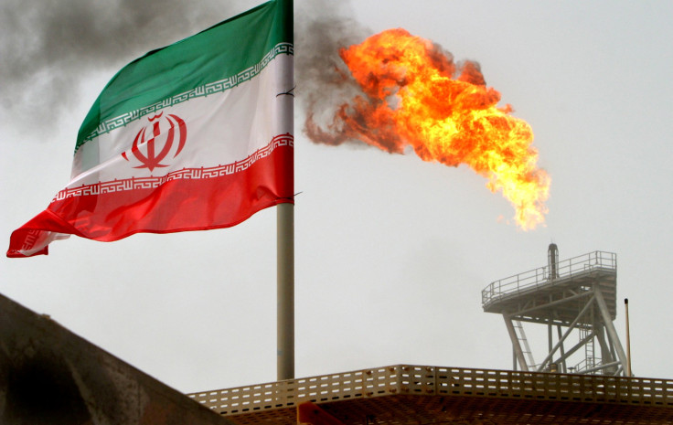 iranA gas flare on an oil production platform in the Soroush oil fields is seen alongside an Iranian flag in the Persian Gulf, Iran, July 25, 2005. REUTERS/Raheb Homavandi/File Photo