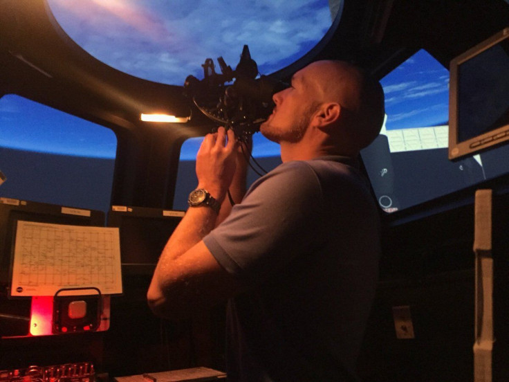 Astronaut using sextant