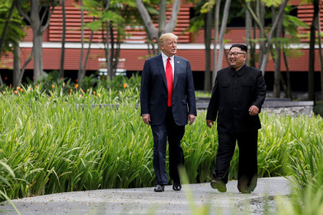 Trump, Kim Jong Un walk