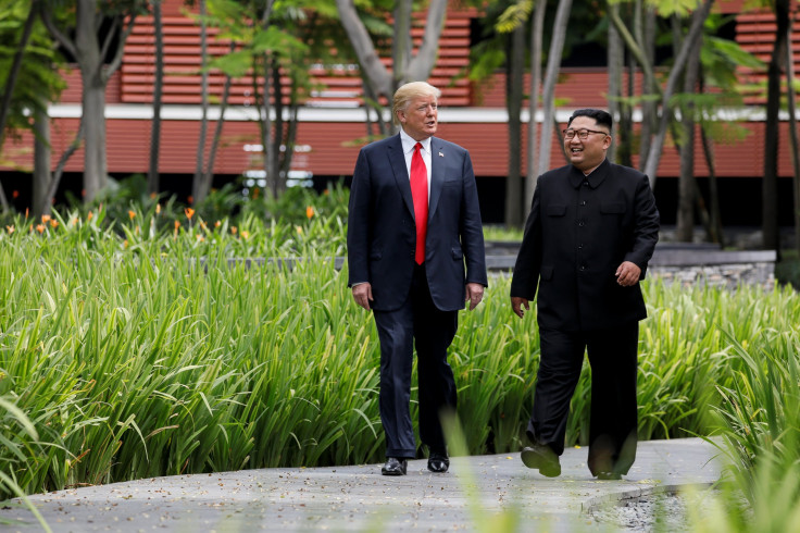 Trump, Kim Jong Un walk