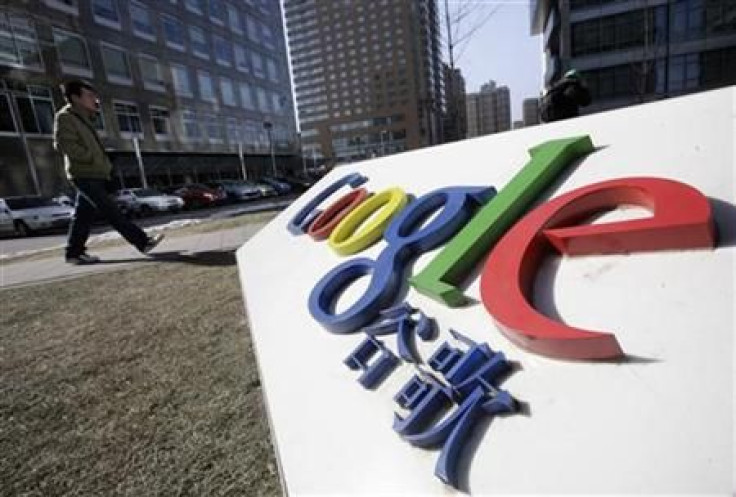 A man walks past a logo of Google China in front of its headquarters in Beijing