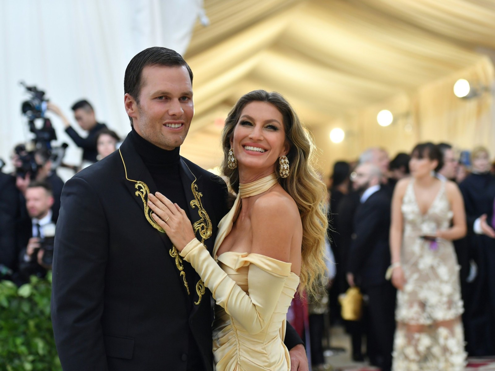 gisele bundchen gold dress Gisele Bndchen in Versace, Fall/Winter 1999. First seen on the runway, then worn by her to the Met Gala that same year. A sheer nude slip layered with coral and gold beading,