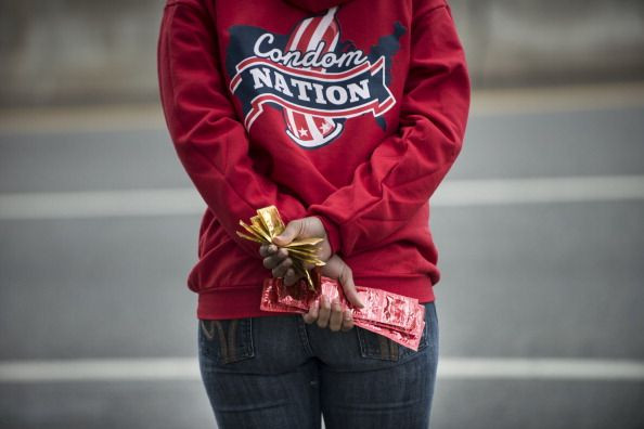 Volunteer handing out condoms