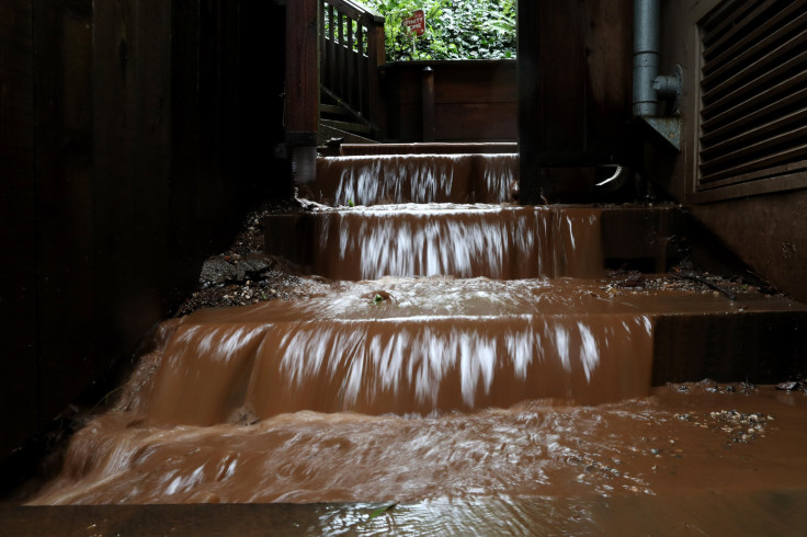 Muddy water flows down stairs