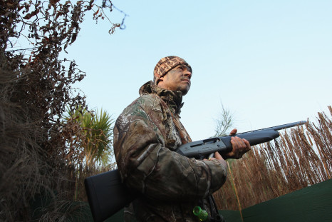 New Zealand duck hunter with gun