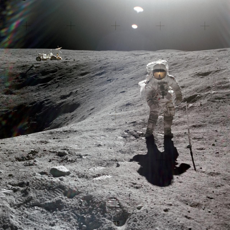 Astronaut Charles Duke photographed collecting lunar samples at Station 1