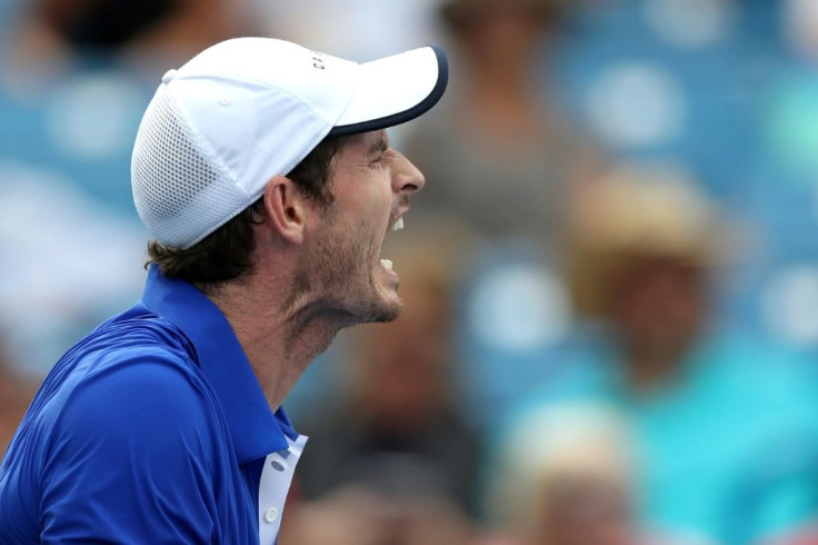 Singles start: Britain's Andy Murray lets out a yell in his first-round loss to Richard Gasquet at the Cincinnati Masters -- Murray's first singles match since January