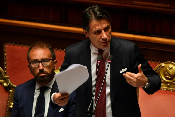 Italian Prime Minister Giuseppe Conte gestures as he delivers a speech at the Italian Senate, in Rome, on August 20, 2019, as the country faces a political crisis