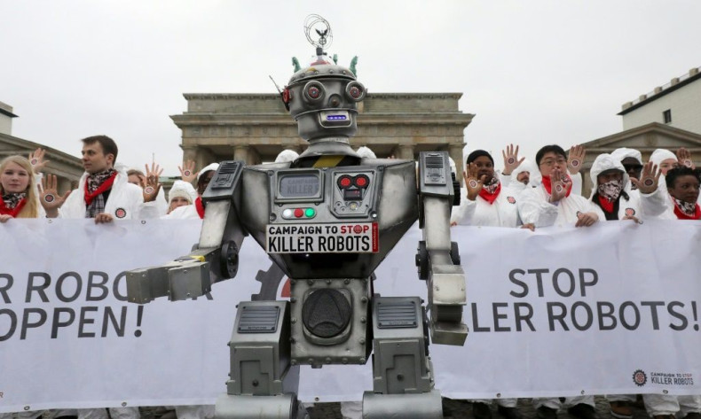 Demonstrators in Berlin take part in a "Stop Killer Robots" campaign organized by German NGO "Facing Finance" to ban what they call killer robots, in March 2019