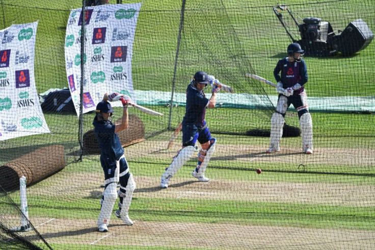 England's Chris Woakes, Jason Roy and captain Joe Root practice