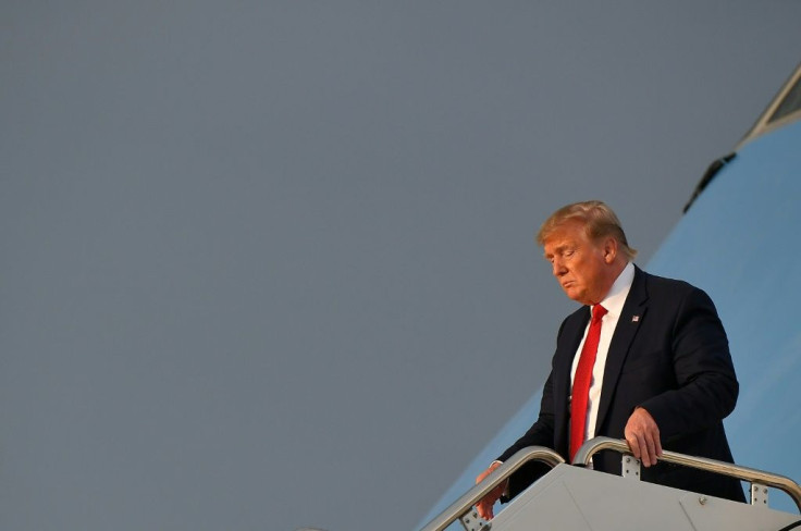 US President Donald Trump steps off Air Force One at Andrews Air Force Base on August 21