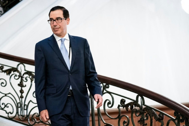 US Treasury Secretary Steven Mnuchin -- seen here at the G7 Summit in Biarritz, France -- says Donald Trump has the authority to force US companies to stop dealing with China, but has yet to exercise it