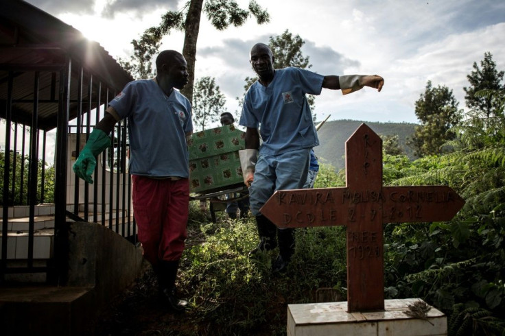 Epidemic: Health workers in the eastern city of Butembo carry a coffin containing a victim of Ebola