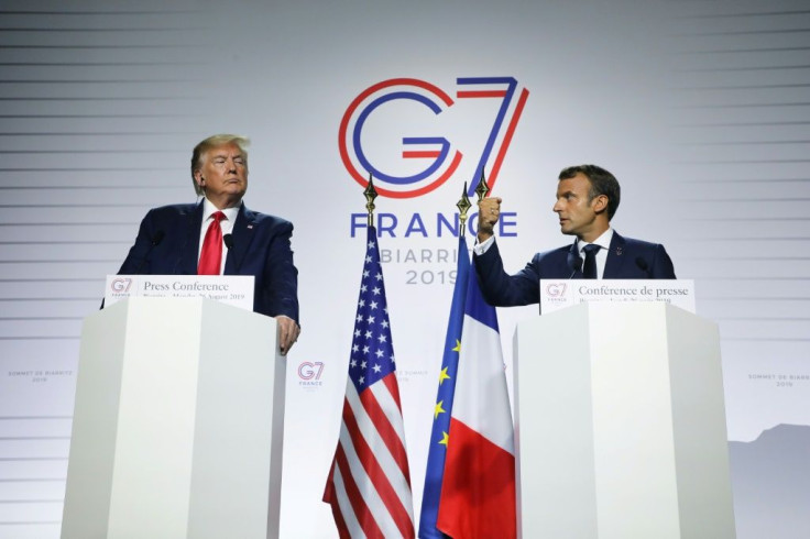 France's President Emmanuel Macron (R) and US President Donald Trump deliver a joint press conference in Biarritz, south-west France on August 26, 2019, on the third day of the annual G7 Summit