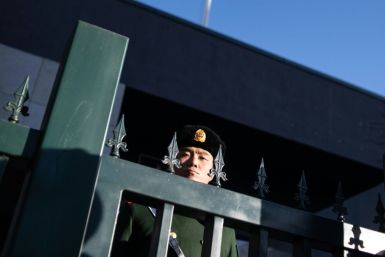 A Chinese police officer stands guard at the Australian embassy in Beijing