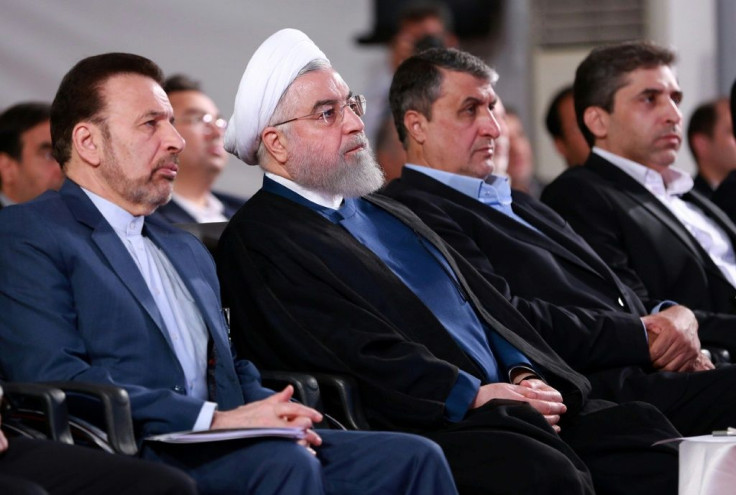 A handout picture provided by the Iranian presidency on August 27, 2019, shows President Hassan Rouhani (2 L) attending a ceremony in the capital Tehran